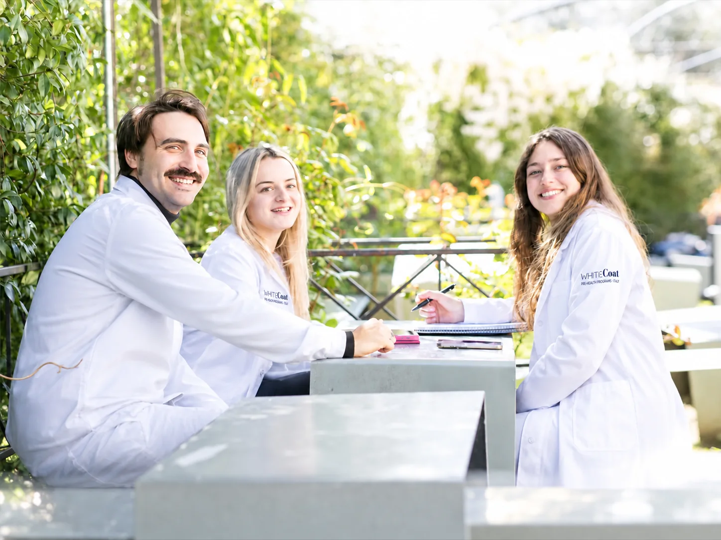Our students in white coats at the Florence campus